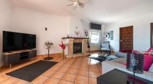 a living room with a couch and a fireplace at Vista Hermosa in Moraira