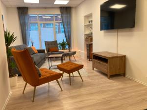 TV a/nebo společenská místnost v ubytování City Apartment