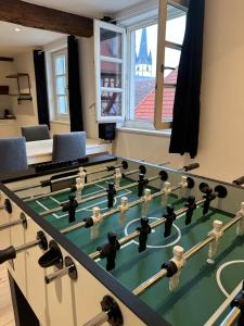 a room with a table with a chess board at Juraperle - Historisch und modern - Wohnung 2 in Bad Staffelstein