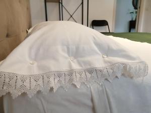 En eller flere senge i et værelse på Suite Petit