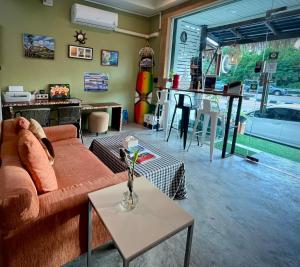 a living room with a couch and a table at Beach House 24 in Ko Lanta