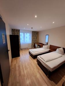 Кровать или кровати в номере City Hotel Frankfurt