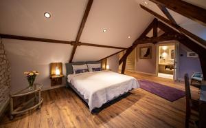 Ένα ή περισσότερα κρεβάτια σε δωμάτιο στο Bel Esprit - Chambres d'hôtes