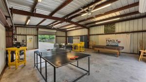 a large room with a ping pong table in it at Shangrila - peaceful getaway on Lake McQueeney in Schumannsville