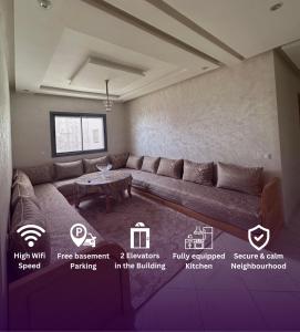 a living room with a couch and a table at Spacious Apartment in heart of Agadir in Agadir