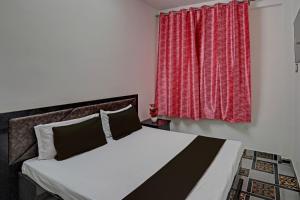 Ένα ή περισσότερα κρεβάτια σε δωμάτιο στο Hotel O VS GALAXY