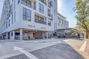 an empty parking lot in front of an apartment building at Casa Vista One Rosebank in Johannesburg