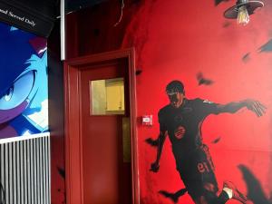 a painting of a man on the wall of a room at Sarah Hotel in Parkeston +14 photos