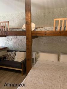 a room with two bunk beds and a couch at CASA PARVATHI CANDELEDA in Candeleda +53 photos