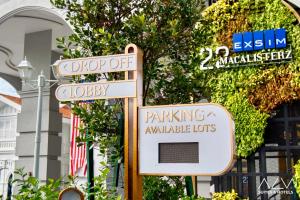 a street sign that says drop off buddy and parking availableoths at 22 Macalisterz by ALV in George Town +91 photos