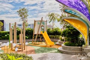 a playground with a slide in a park at 22 Macalisterz by ALV in George Town