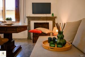 a living room with a couch and a fireplace at Inn Pisa Rentals 2 - Rustic Romantic Pisa Flat in Pisa