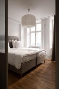 Postel nebo postele na pokoji v ubytování Kings48 by Daniel&Jacob's