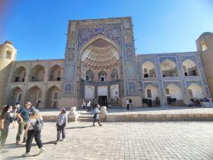 a group of people standing in front of a building at Sahro Hotel in Bukhara