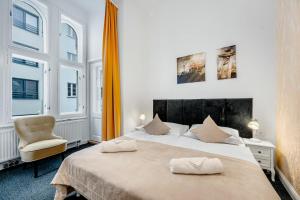 Postel nebo postele na pokoji v ubytování Downtown Bratislava B&B