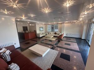 a living room with a couch and a table at Tufad Prestige Boutique in Ankara