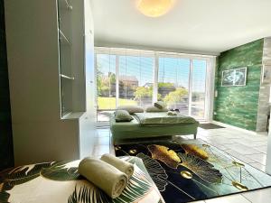 a room with two beds and a fish tank on the floor at Komfortappartement mit Terraasse in Wuppertal +23 photos