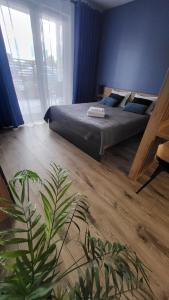 Postel nebo postele na pokoji v ubytování Apartament - Sienkiewicza 22D
