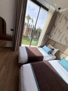 Katil atau katil-katil dalam bilik di Villa B Marrakech +46 gambar