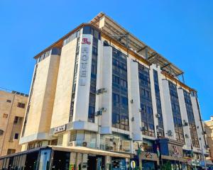 a rendering of the front of a building at Red Carpet Hotel & Suites in Amman