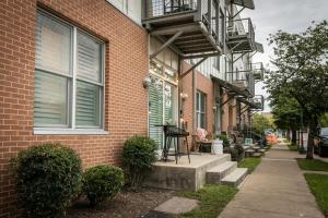a brick building with a balcony on the side of it at The Chattanooga Crossroads Condo in Chattanooga