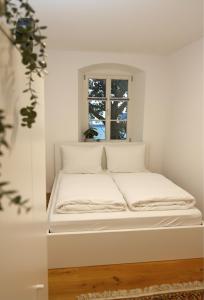 Postel nebo postele na pokoji v ubytování Sand Altstadt Apartments