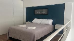 Ένα ή περισσότερα κρεβάτια σε δωμάτιο στο DrPropiedades 311