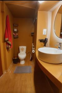 a bathroom with a sink and a toilet at Villa ZeN- with Private garden and beach in Samos +56 photos
