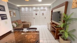 Apto com Varanda, Vista e Piscina a 50m da Praia休息區