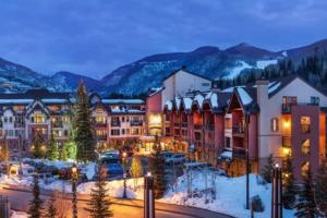a resort in the mountains with snow on the ground at Vail Lion Square 401N in Vail +14 photos