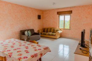 Un televizor și/sau centru de divertisment la Casa Vacanze Alessio