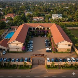 an aerial view of a hotel with cars parked in a parking lot at Lexus Motel Rwamwanja in Kamwenge