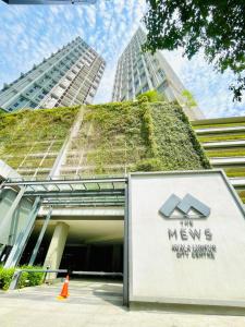 a building with a green roof on top of it at KLCC Sky Villa Suites The Mews in Kuala Lumpur