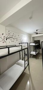 Ένα ή περισσότερα κρεβάτια σε δωμάτιο στο Hippy Trail Guest House and Dorms