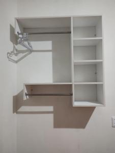 a kitchen sink with a light hanging from a wall at Cantinho Amazônico Cop 30 in Belém +17 photos