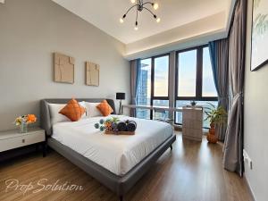 a bedroom with a bed and a large window at Spacious Cozy Elysia Suite Johor Bahru Legoland in Iskandar Puteri +110 photos