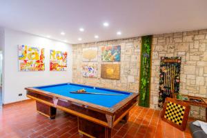 a pool table in the middle of a room at Apartment In Villa With Pool On Umbrian Hills in Stroncone +15 photos