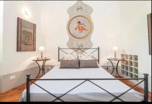 a bedroom with a large bed and two side tables at Amalfi 2 rooms 1fl no terrace 2fl private terrace sea view in Atrani