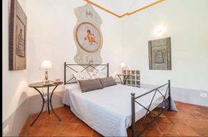 a bedroom with a bed and a table in it at Amalfi 2 rooms 1fl no terrace 2fl private terrace sea view in Atrani