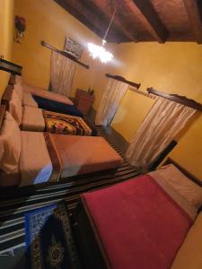 Ένα ή περισσότερα κρεβάτια σε δωμάτιο στο Auberge Jbel Raids +13 φωτογραφίες