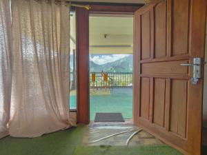 an open door to a room with a view at Looks Villa Strawberry Sembalun in Sembalun Lawang