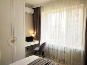 Ένα ή περισσότερα κρεβάτια σε δωμάτιο στο Островок комфорта и современности