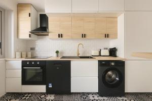 Kuchyň nebo kuchyňský kout v ubytování Appartement charmant au coeur du 16eme