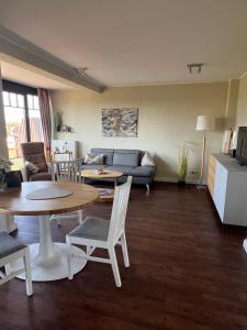 Posezení v ubytování Urlaubstraeume-am-Meer-Wohnung-6-8-9808 + 10 fotografií