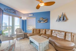 a living room with a couch and a table at August Beach Getaway Specials Book & Save! in St. Pete Beach +32 photos