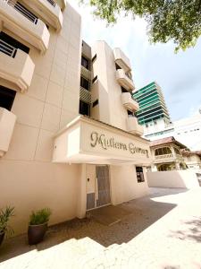 a building with a sign for a nursing center at Mutiara Gurney at 15, Lorong Kelawai in George Town