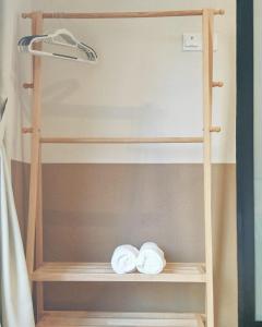 a bunk bed with two towels on a shelf at Mutiara Gurney at 15, Lorong Kelawai in George Town