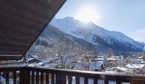 a view of a snowy mountain from a balcony at Plan B Hotel - Living Chamonix in Chamonix