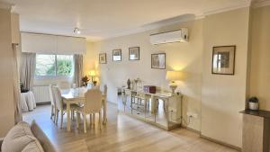 a kitchen and dining room with a table and chairs at STAY Charm Classic Apartment in Strovolos +38 photos