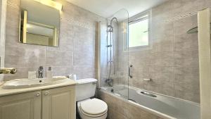 a bathroom with a toilet and a sink and a shower at STAY Charm Classic Apartment in Strovolos